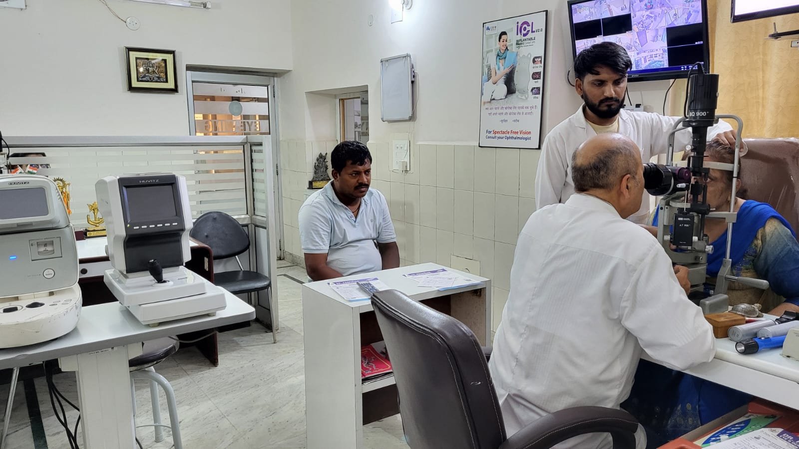 Dr. Sanjay Kumar examining a patient at the slit lamp